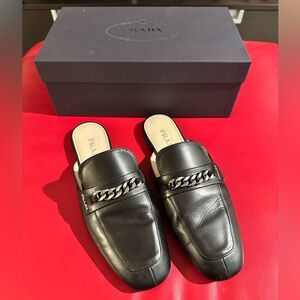 Prada Black Leather Mules with Chain Accent